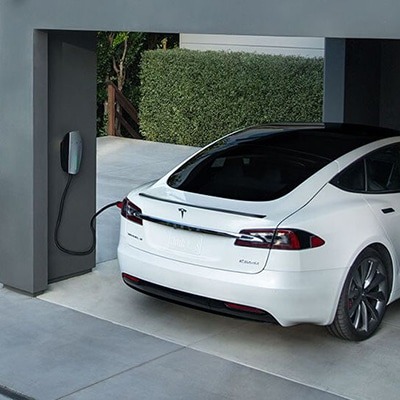 Tesla Model S connected to a wall charging point