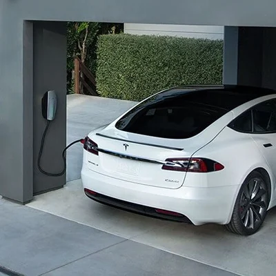 Electric car connected to a residential wall charging point
