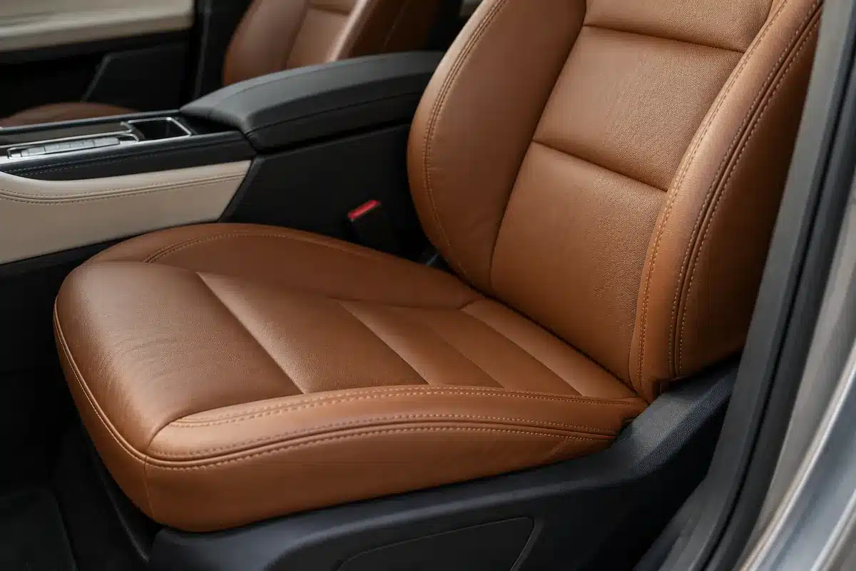 Cognac leather car seats with tailored stitching and dark interior trim