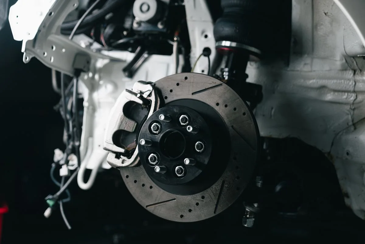 Exposed brake disc and caliper with the wheel removed