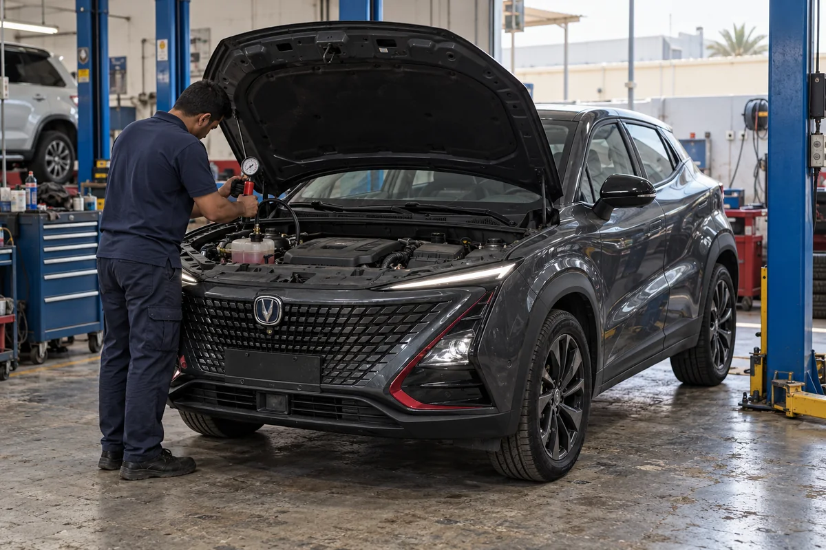 Technician using a cooling system pressure tester on a Changan UNI-T