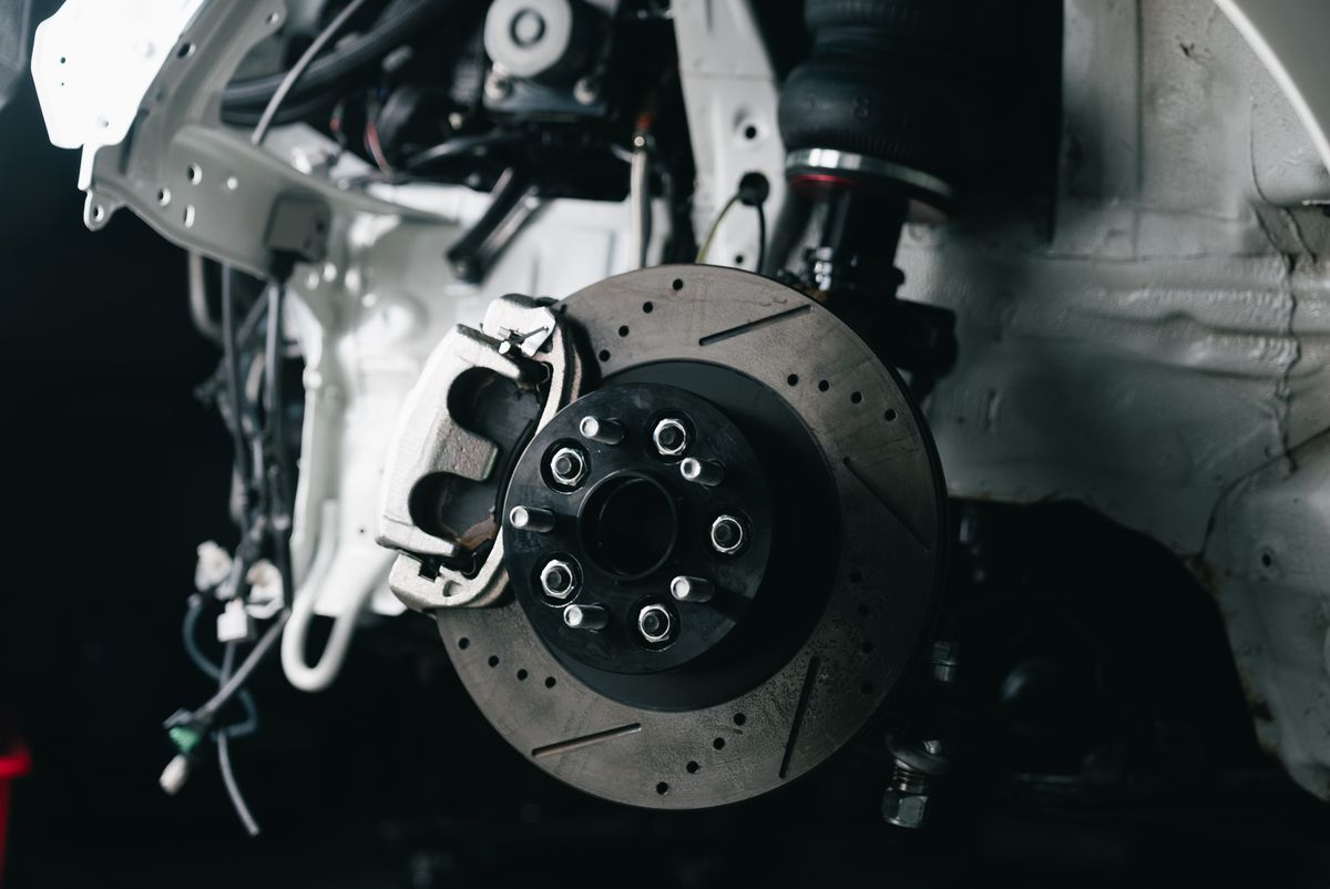 Brake disc and caliper exposed with the wheel removed