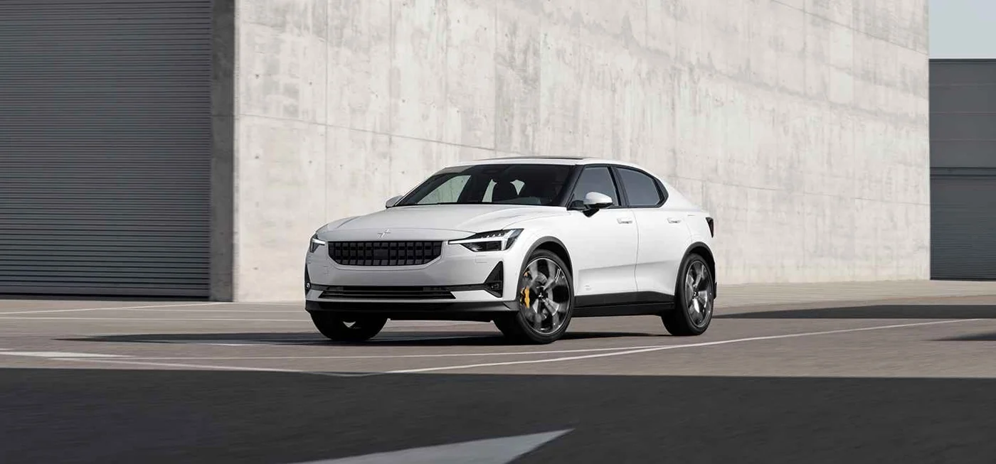White Polestar 2 viewed from the front on a paved road