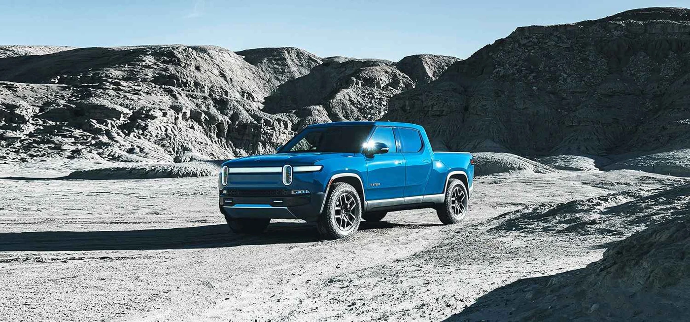 Blue Rivian R1T electric pickup viewed from the front