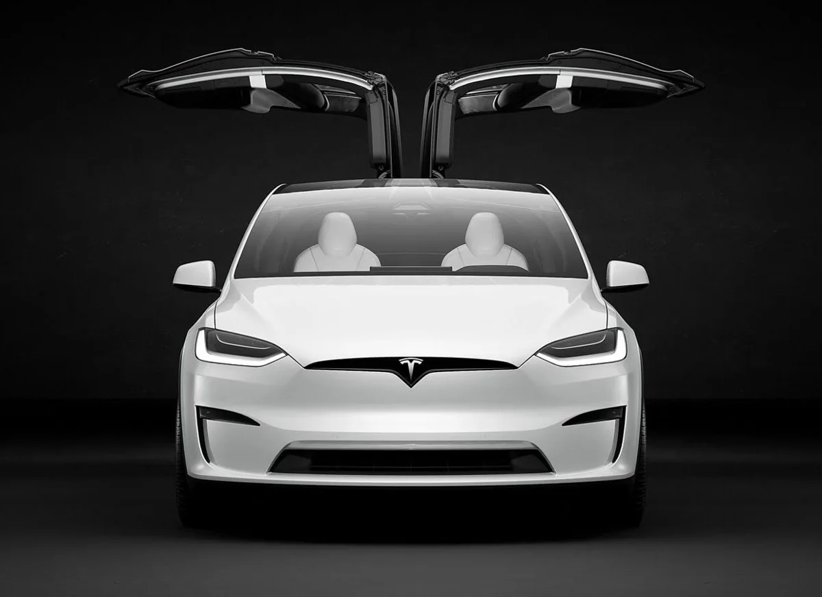 White Tesla Model X with falcon-wing doors open