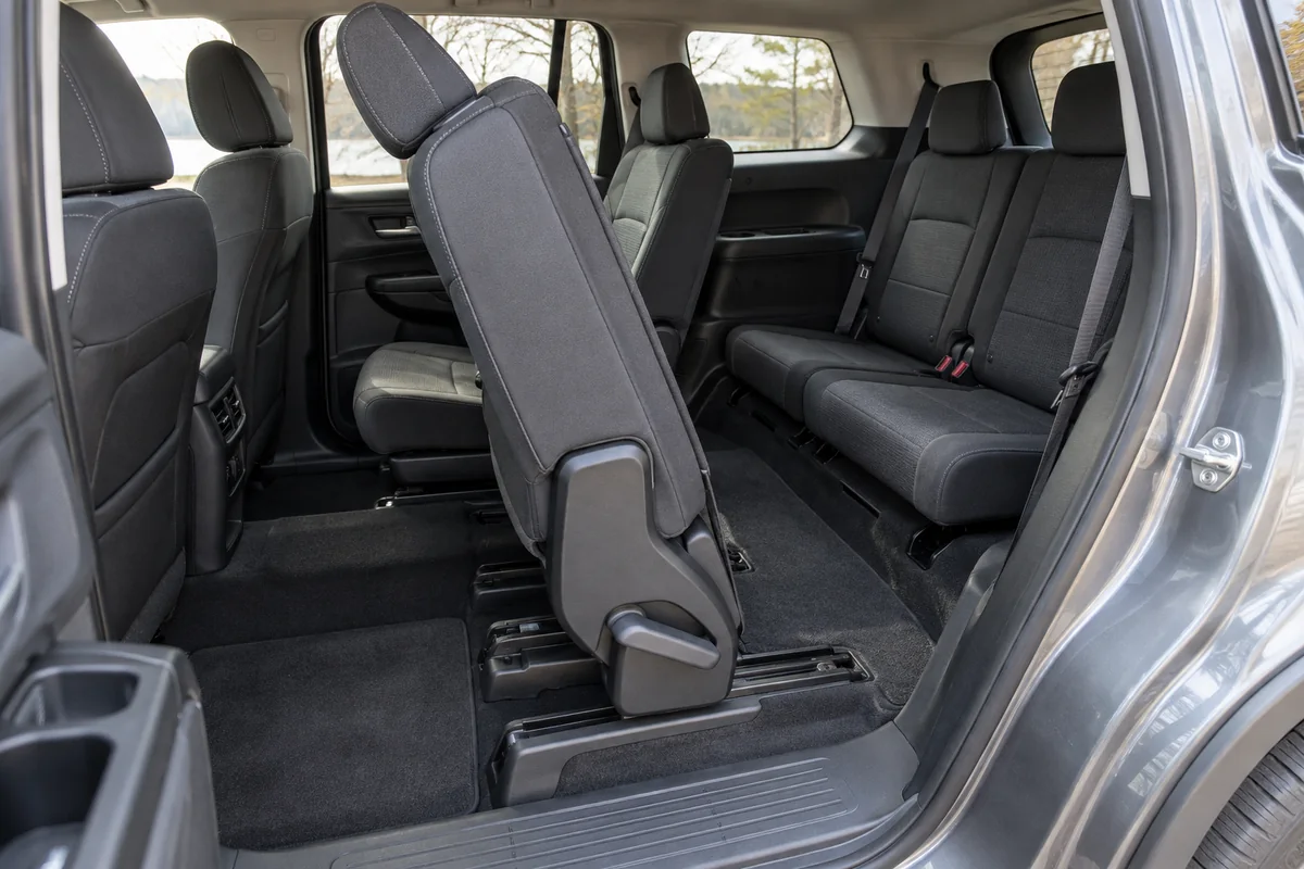 Second-row seat moved forward to show access to two third-row seats