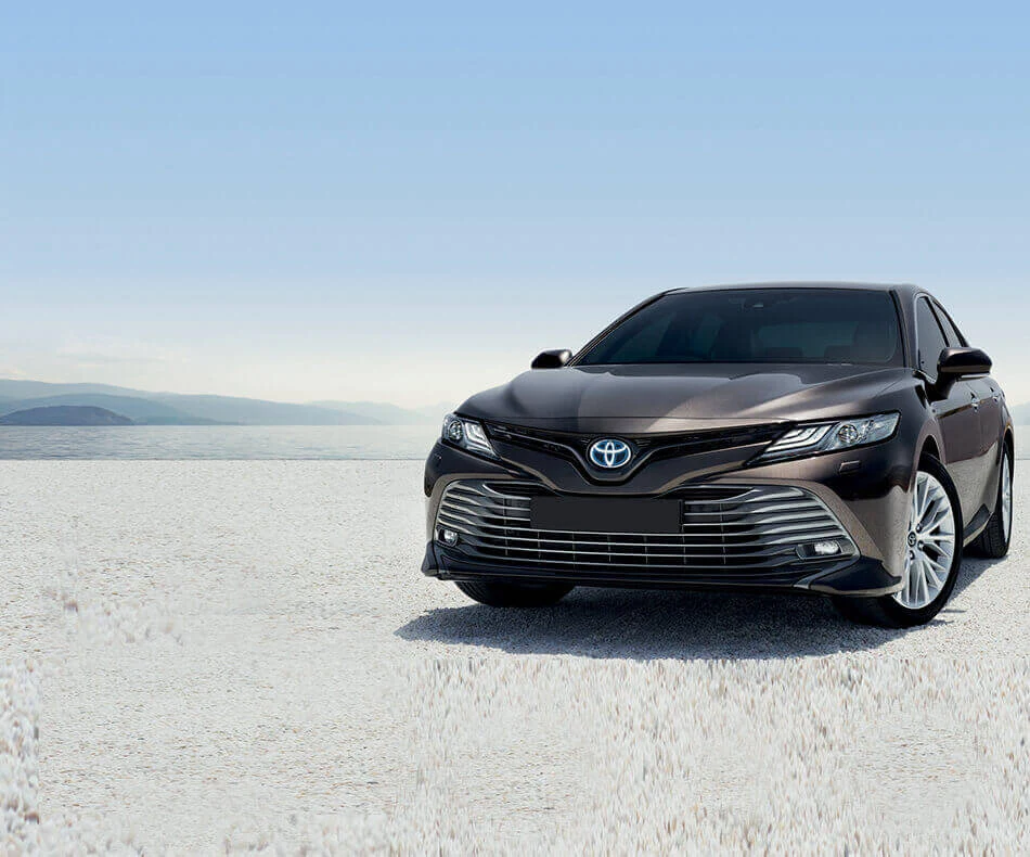 Toyota Camry parked on open ground